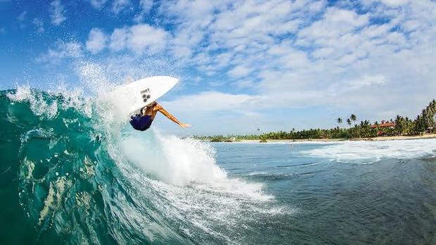 Surfers in the bay at Weligama